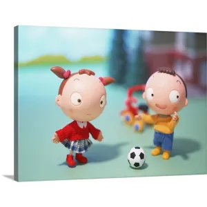 "Boy and Girl playing soccer" Canvas Wall Art