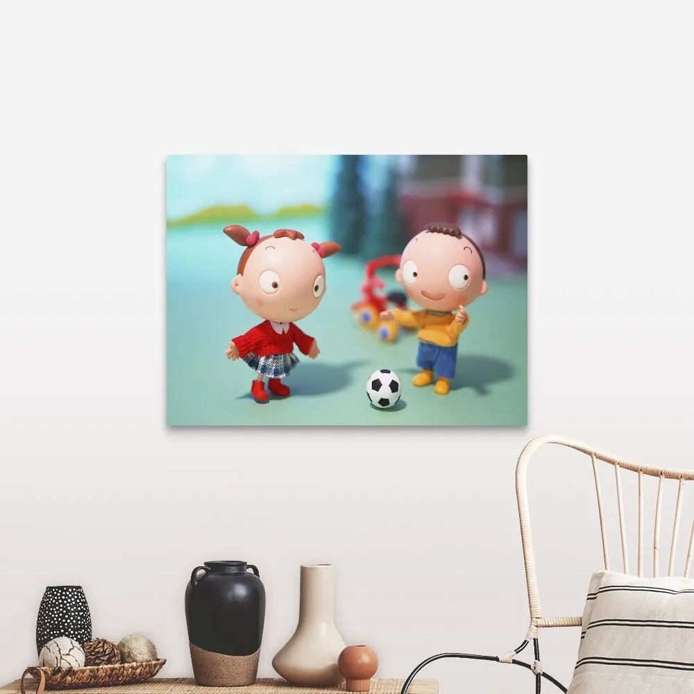 "Boy and Girl playing soccer" Canvas Wall Art
